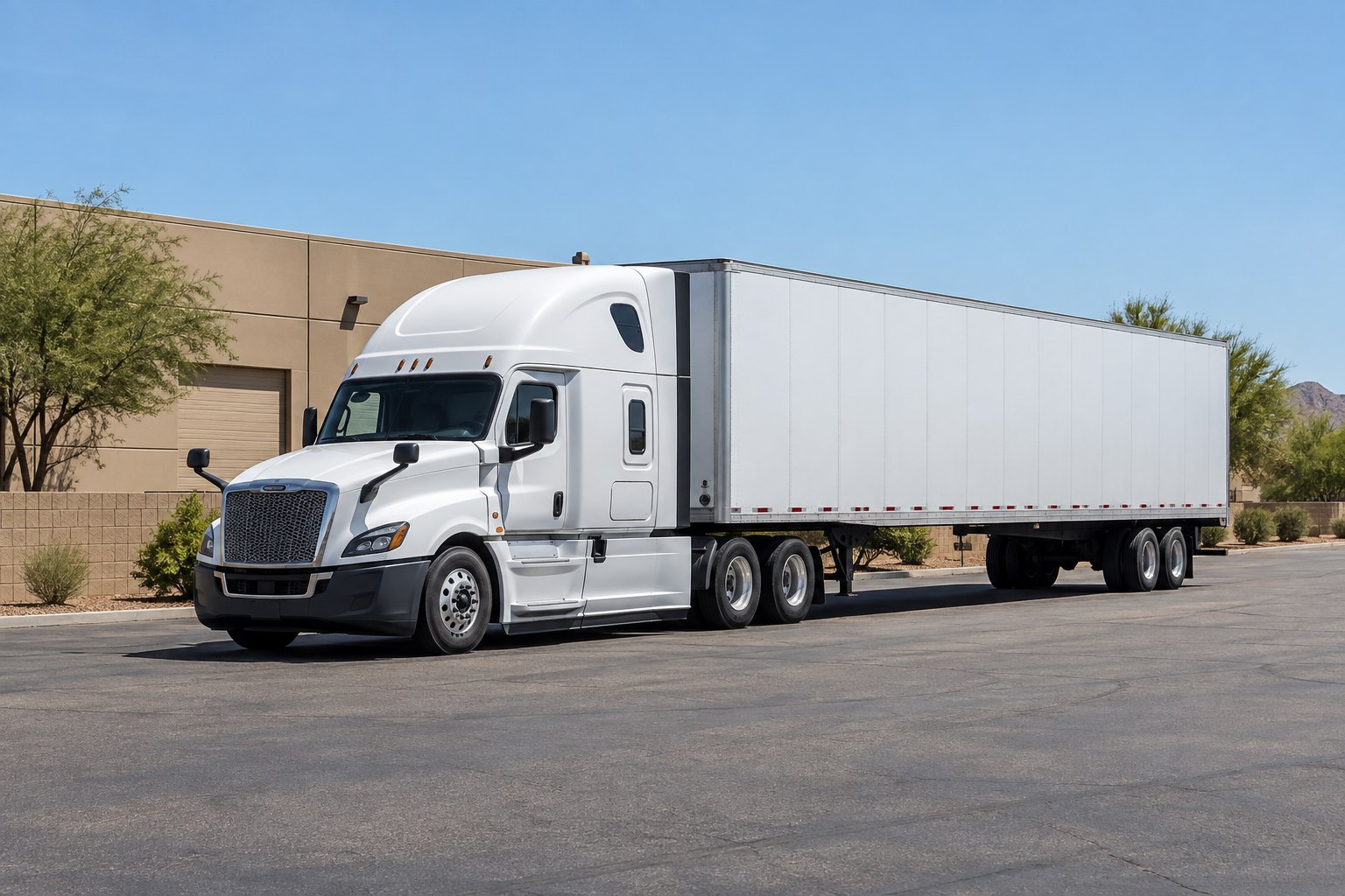 Illustrative white freight truck in a sunlit Tempe-style industrial yard